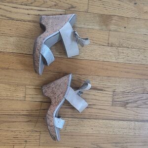 Worn old silver strap wedge heels
